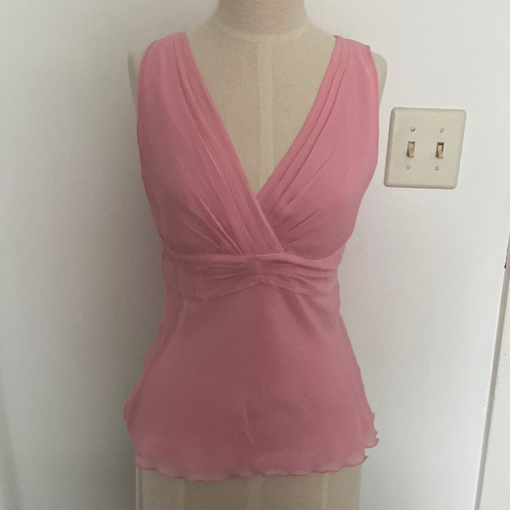 Flattering 100% silk top to wear to your next summer party.